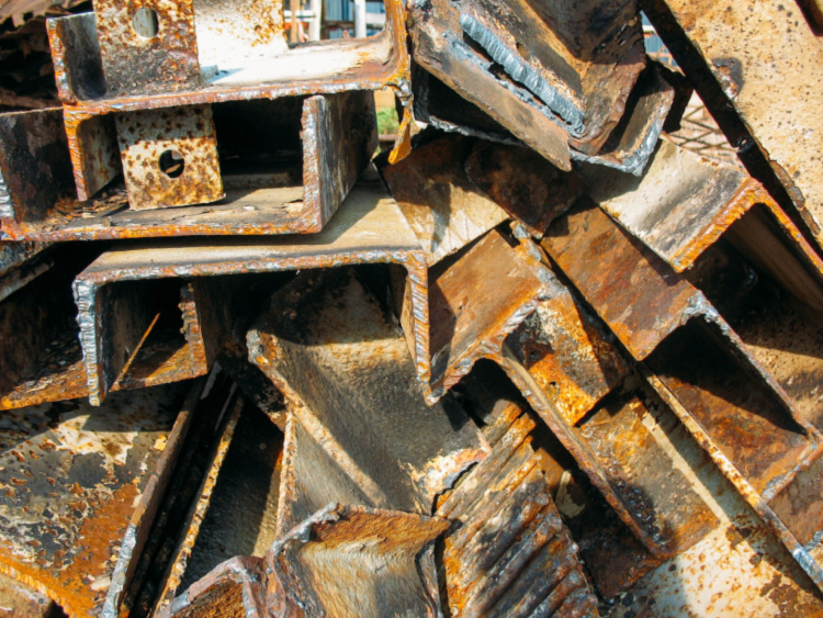 A stack of rusty metal beams
